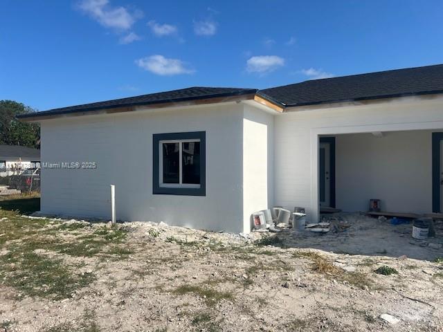 11870 SW 220th St, Miami, FL 33170 - view of side of property with stucco siding