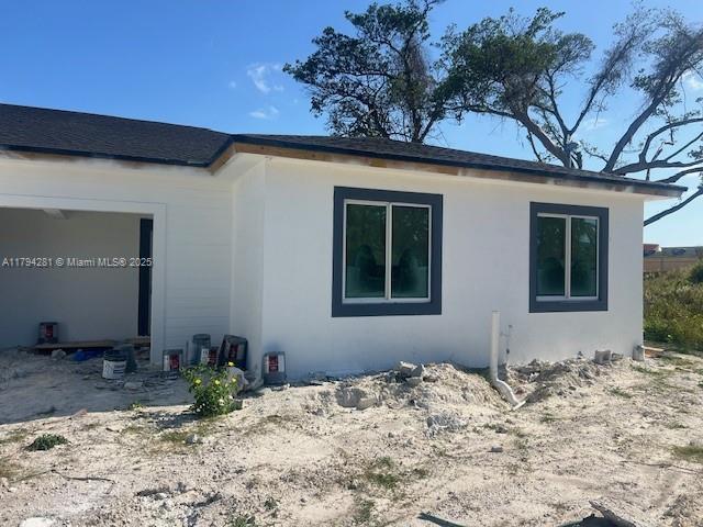 11870 SW 220th St, Miami, FL 33170 - view of home's exterior with stucco siding