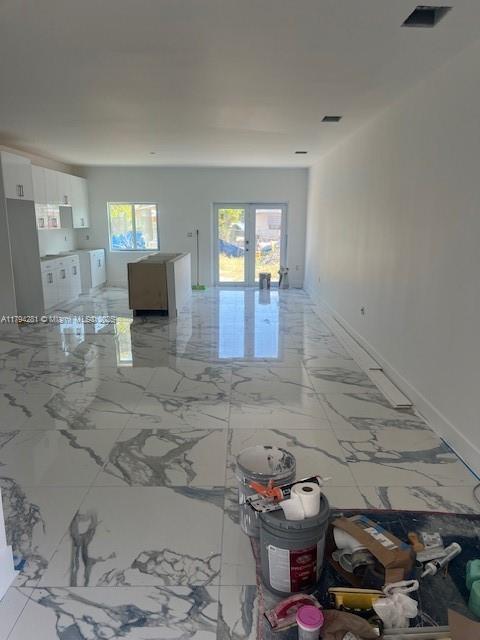 11870 SW 220th St, Miami, FL 33170 - unfurnished room featuring french doors, marble finish floor, and visible vents