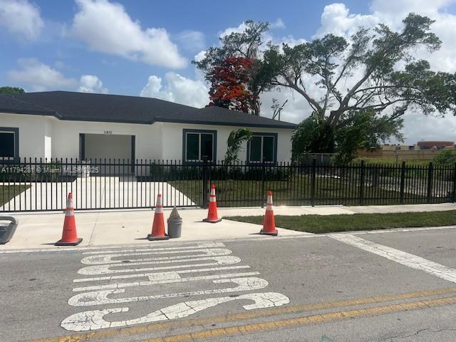 11870 SW 220th St, Miami, FL 33170 - ranch-style home featuring stucco siding and a garage