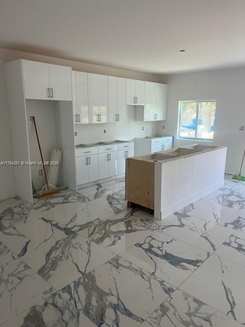 11870 SW 220th St, Miami, FL 33170 - kitchen featuring white cabinets and marble finish floor