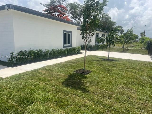 11870 SW 220th St, Miami, FL 33170 - view of home's exterior with a yard