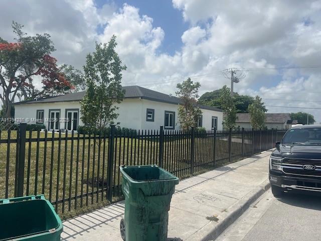 11870 SW 220th St, Miami, FL 33170 - ranch-style home featuring a fenced front yard and french doors