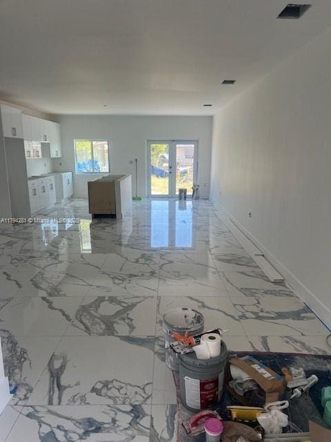 11870 SW 220th St, Miami, FL 33170 - unfurnished living room with french doors and light marble finish floors
