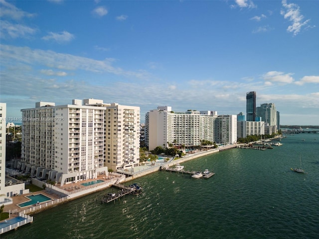 bird's eye view featuring a water view and a city view