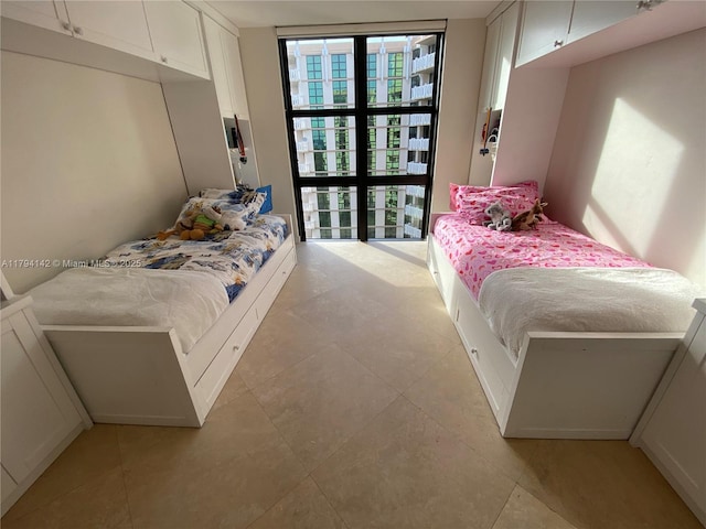 1121 Crandon Blvd Unit D902, Key Biscayne, FL 33149 - bedroom with light tile patterned floors and a wall of windows