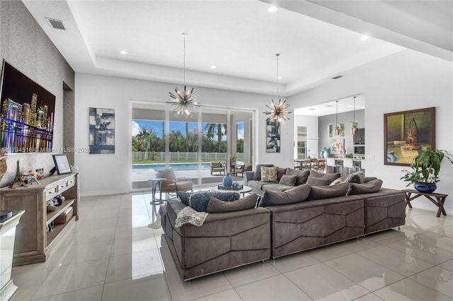 5202 S Sterling Ranch Cir, Davie, FL 33314 - living room featuring light tile patterned floors, a raised ceiling, and recessed lighting