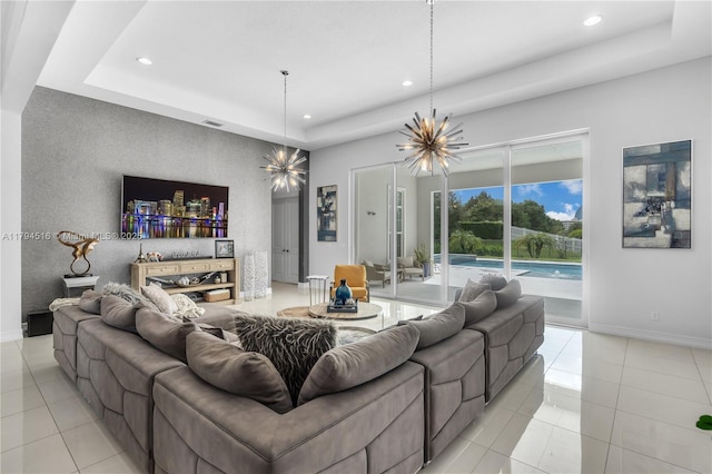 5202 S Sterling Ranch Cir, Davie, FL 33314 - living room featuring recessed lighting, a tray ceiling, an inviting chandelier, and light tile patterned floors