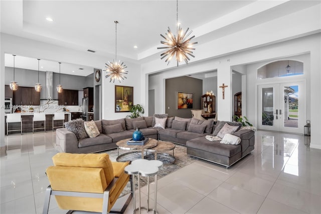 5202 S Sterling Ranch Cir, Davie, FL 33314 - living area with a tray ceiling, recessed lighting, light tile patterned flooring, and a notable chandelier