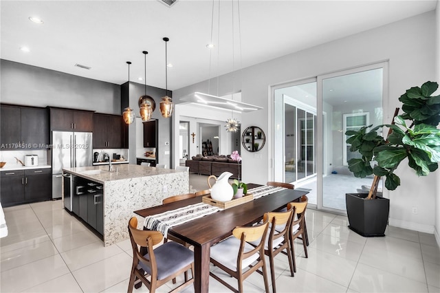 5202 S Sterling Ranch Cir, Davie, FL 33314 - kitchen featuring light tile patterned floors, freestanding refrigerator, a sink, and visible vents