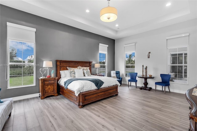 5202 S Sterling Ranch Cir, Davie, FL 33314 - bedroom with light wood-style floors, recessed lighting, baseboards, and a tray ceiling