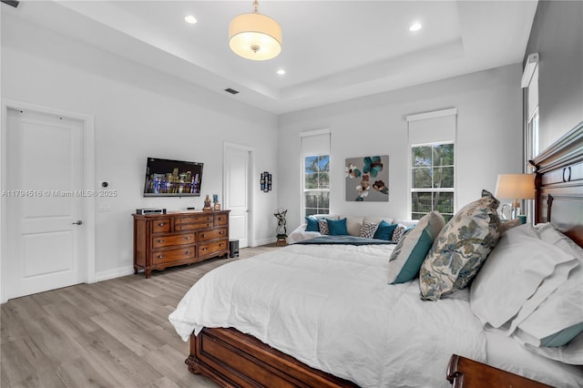 5202 S Sterling Ranch Cir, Davie, FL 33314 - bedroom with visible vents, wood finished floors, a raised ceiling, baseboards, and recessed lighting