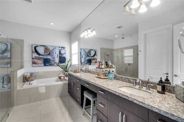 5202 S Sterling Ranch Cir, Davie, FL 33314 - full bath with a sink, tile patterned flooring, a shower stall, and a garden tub