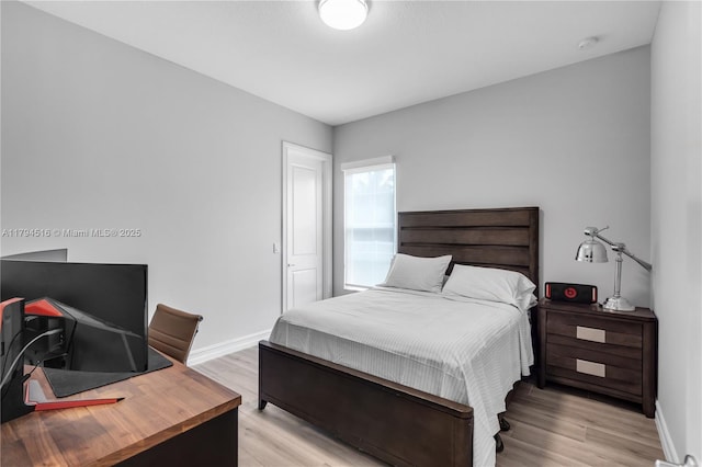 5202 S Sterling Ranch Cir, Davie, FL 33314 - bedroom featuring light wood-type flooring and baseboards