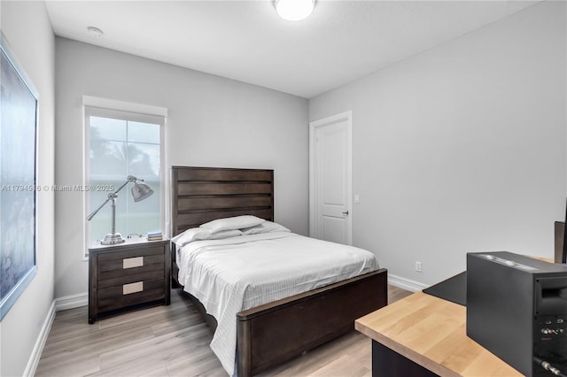 5202 S Sterling Ranch Cir, Davie, FL 33314 - bedroom featuring baseboards and light wood-style floors