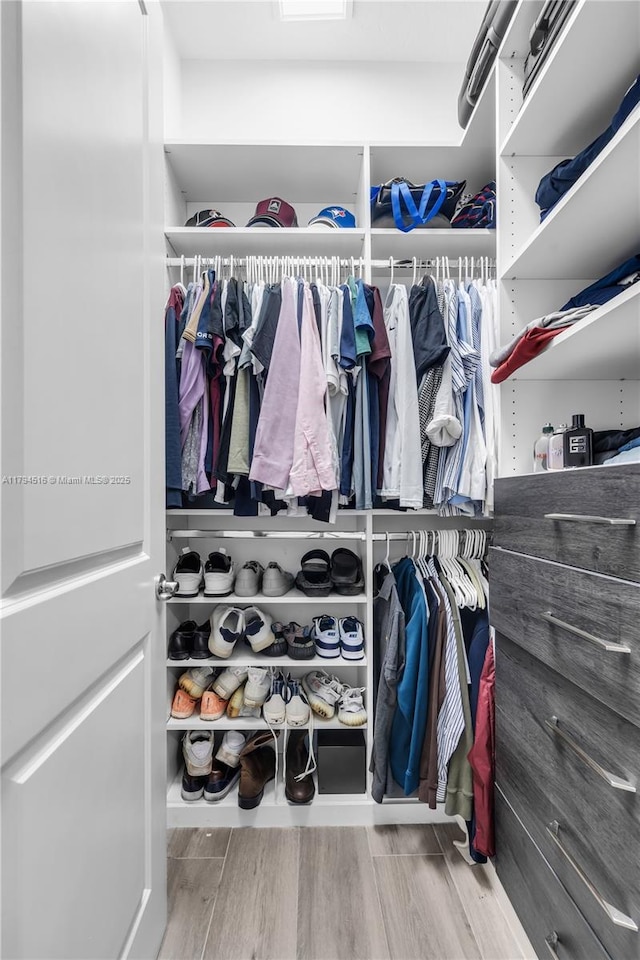 5202 S Sterling Ranch Cir, Davie, FL 33314 - walk in closet featuring wood finished floors