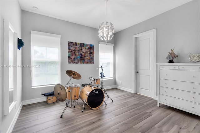 5202 S Sterling Ranch Cir, Davie, FL 33314 - playroom with baseboards, wood finished floors, and a healthy amount of sunlight