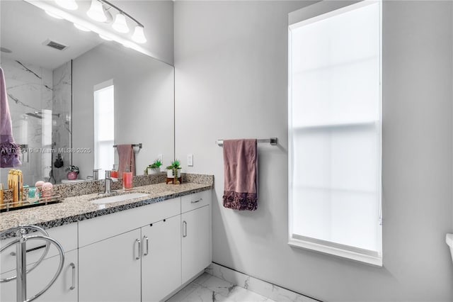 5202 S Sterling Ranch Cir, Davie, FL 33314 - full bath with visible vents, marble finish floor, a marble finish shower, and vanity