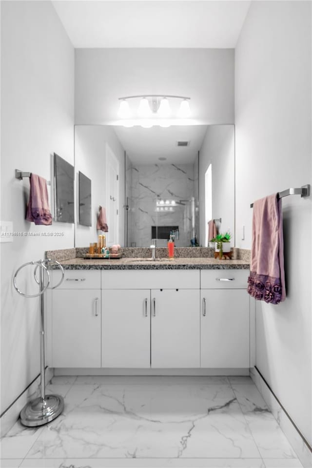 5202 S Sterling Ranch Cir, Davie, FL 33314 - bathroom with baseboards, a marble finish shower, marble finish floor, and vanity
