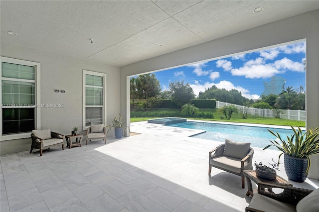 5202 S Sterling Ranch Cir, Davie, FL 33314 - view of swimming pool with a patio, a fenced backyard, and a pool with connected hot tub