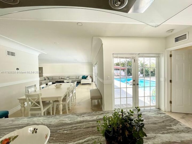 416 N Rainbow Dr, Hollywood, FL 33021 - dining area with french doors and baseboards