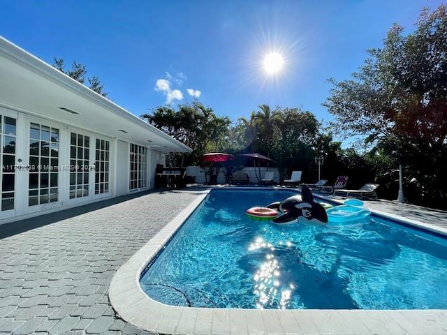 416 N Rainbow Dr, Hollywood, FL 33021 - view of swimming pool featuring french doors and a patio area