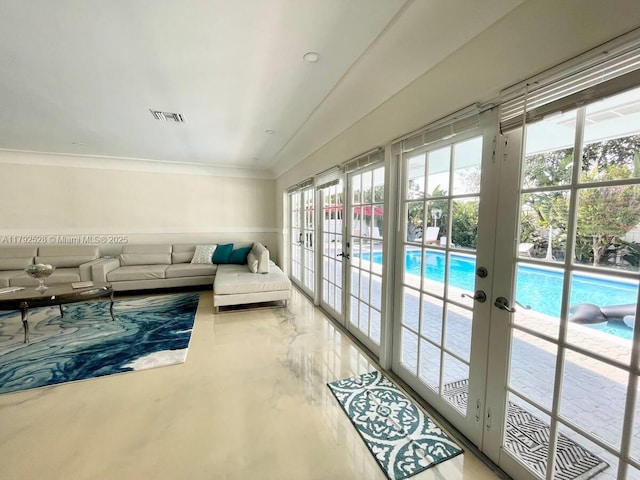 416 N Rainbow Dr, Hollywood, FL 33021 - living room with french doors, ornamental molding, and concrete floors