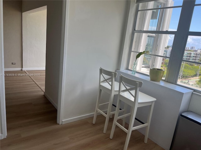 3 Island Ave Unit 08A, Miami Beach, FL 33139 - dining area featuring wood finished floors and baseboards