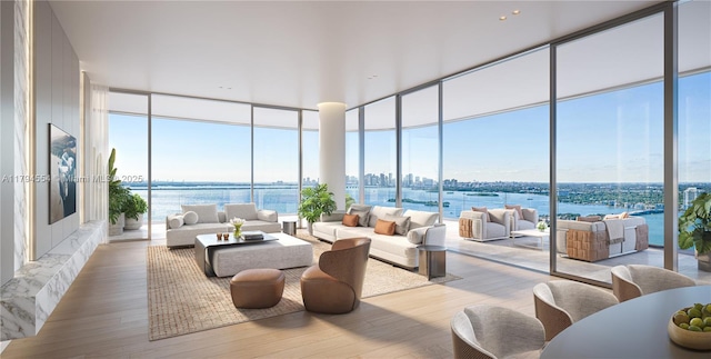 sunroom / solarium with plenty of natural light and a water view