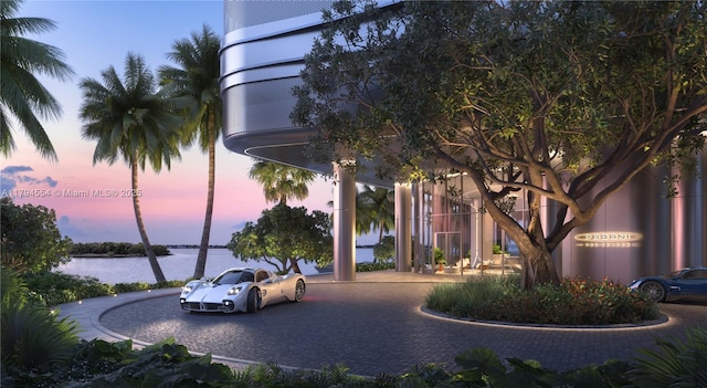 surrounding community with a water view