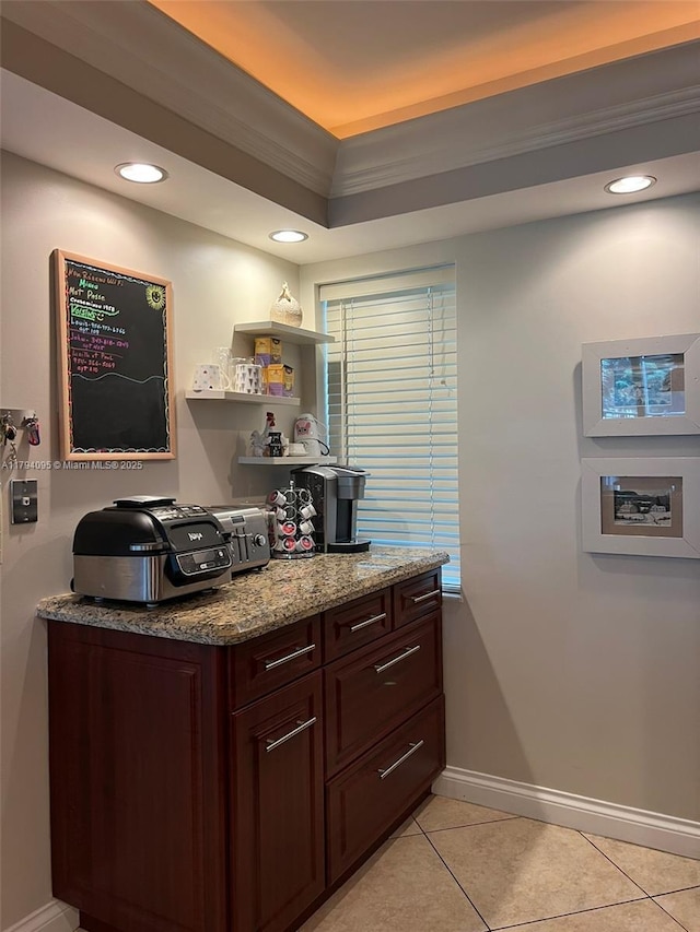 bar featuring baseboards, recessed lighting, crown molding, and light tile patterned floors