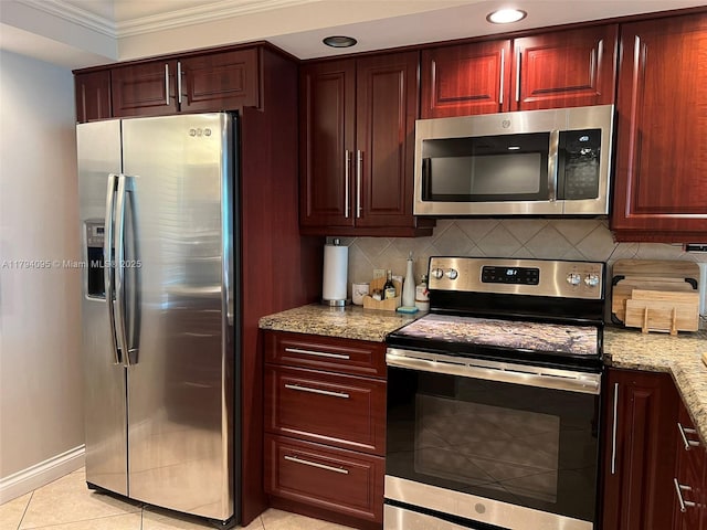 kitchen featuring crown molding, light stone countertops, stainless steel appliances, baseboards, and tasteful backsplash