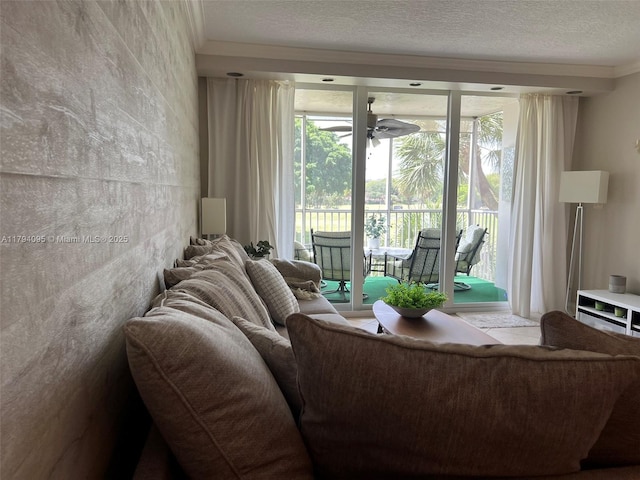 living room with a textured ceiling and ceiling fan