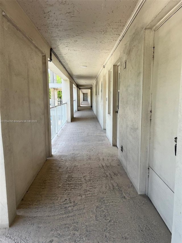 hallway featuring carpet flooring