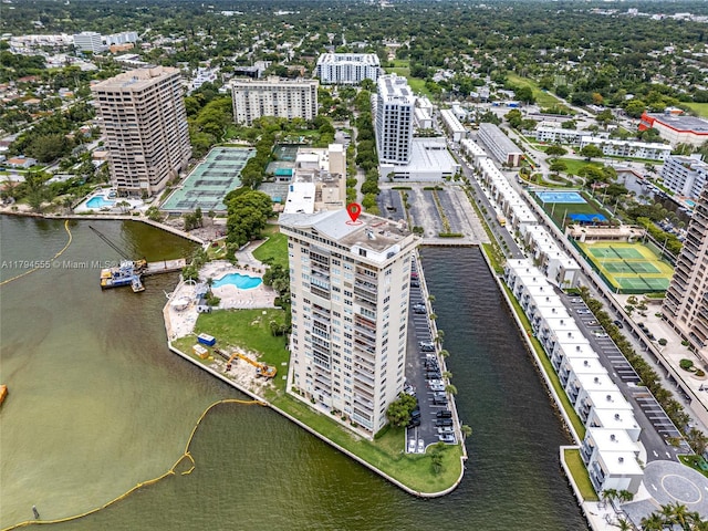 birds eye view of property featuring a water view and a city view