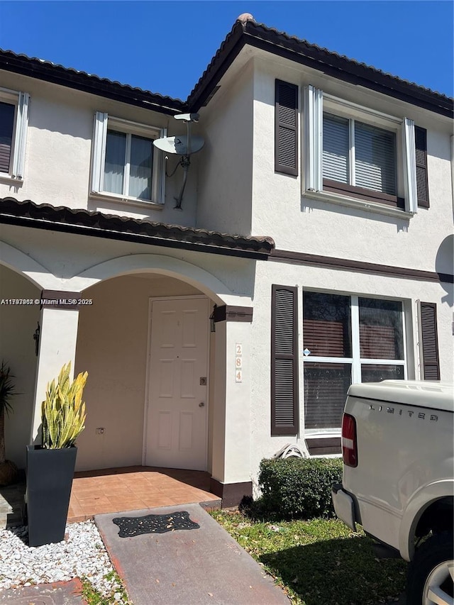 8515 SW 152nd Ave Unit 284, Miami, FL 33193 - view of front facade featuring a tiled roof and stucco siding