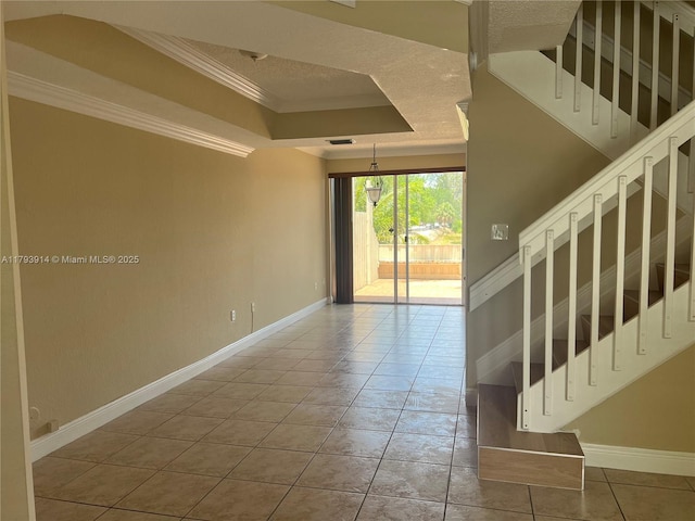 8515 SW 152nd Ave Unit 284, Miami, FL 33193 - interior space featuring baseboards, ornamental molding, a raised ceiling, and stairs