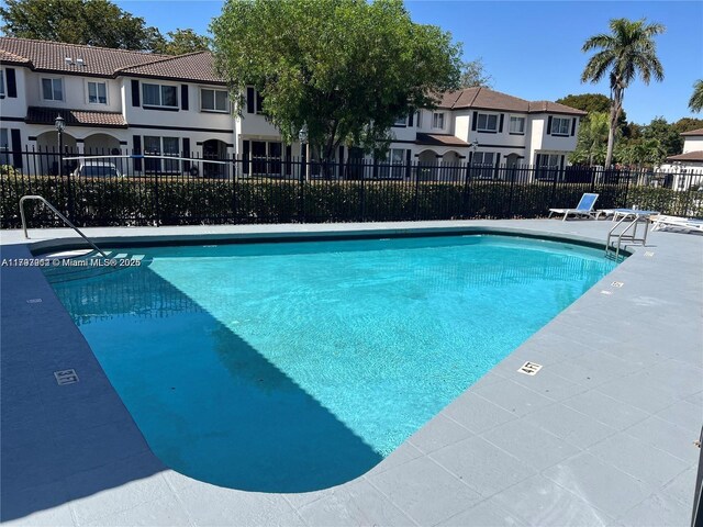 8515 SW 152nd Ave Unit 284, Miami, FL 33193 - community pool with a residential view, fence, and a patio area