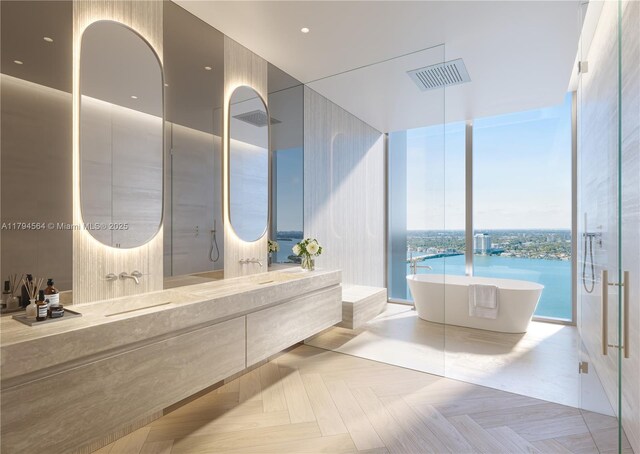 7940 W Dr Unit 1702, North Bay Village, FL 33141 - full bathroom with visible vents, double vanity, a freestanding tub, and floor to ceiling windows