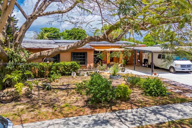 9341 Marine Dr, Cutler Bay, FL 33189 - ranch-style house with roof mounted solar panels and stucco siding