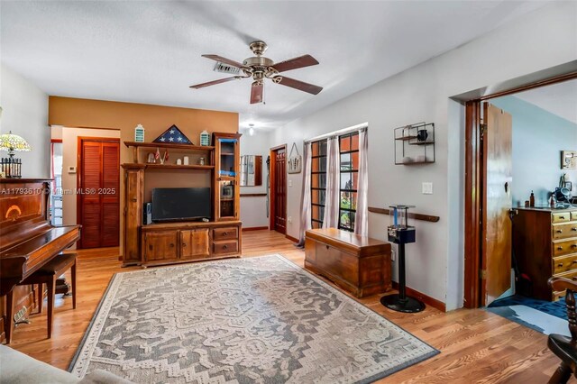 9341 Marine Dr, Cutler Bay, FL 33189 - living area featuring baseboards, ceiling fan, and light wood-style flooring
