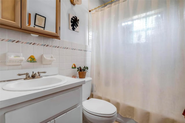 9341 Marine Dr, Cutler Bay, FL 33189 - bathroom with vanity, toilet, shower / bath combo with shower curtain, tile walls, and tasteful backsplash