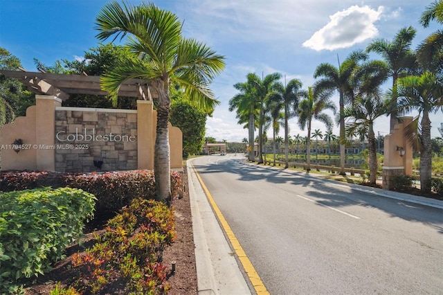 view of street featuring curbs