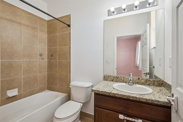 bathroom featuring shower / bath combination, vanity, and toilet