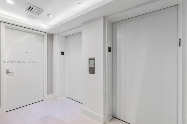 3801 Collins Ave Unit 703, Miami Beach, FL 33140 - hall with elevator, visible vents, and baseboards