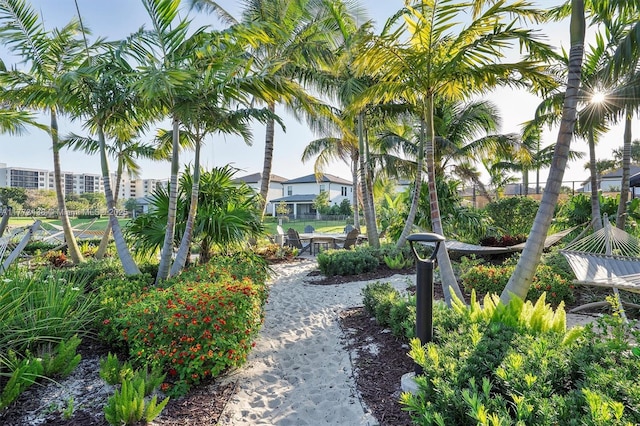 view of community featuring fence