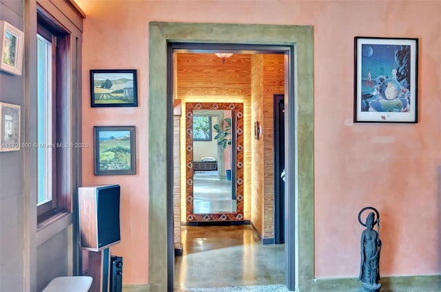 hall with concrete floors