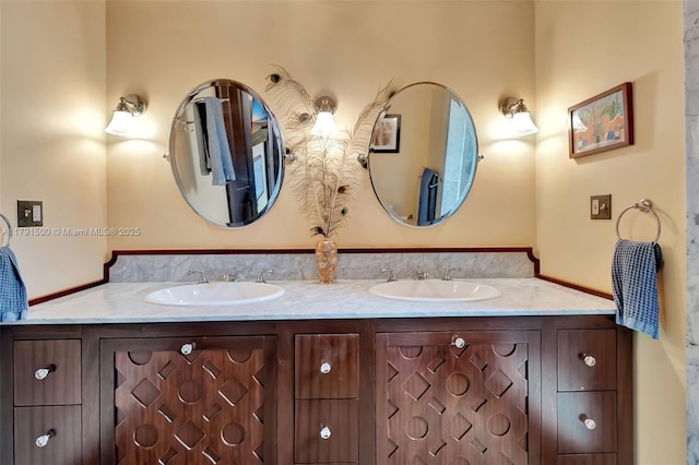bathroom with double vanity and a sink