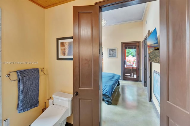 bathroom featuring crown molding and concrete floors