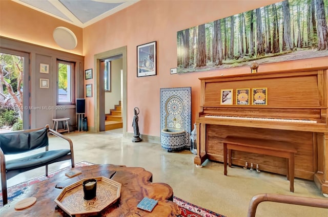 2760 Kirk St, Coconut Grove, FL 33133 - sitting room featuring finished concrete floors, stairs, and baseboards